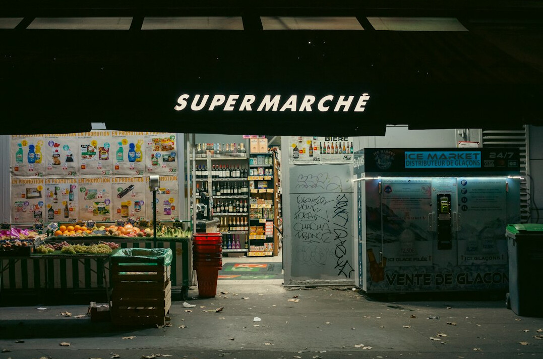 supermarket security guard observing shopper