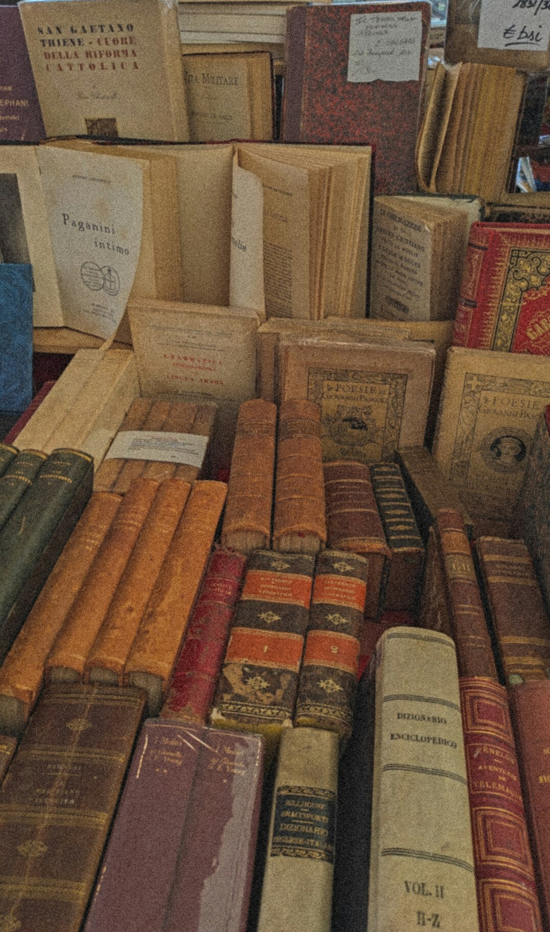 Rows of old books and archive volumes