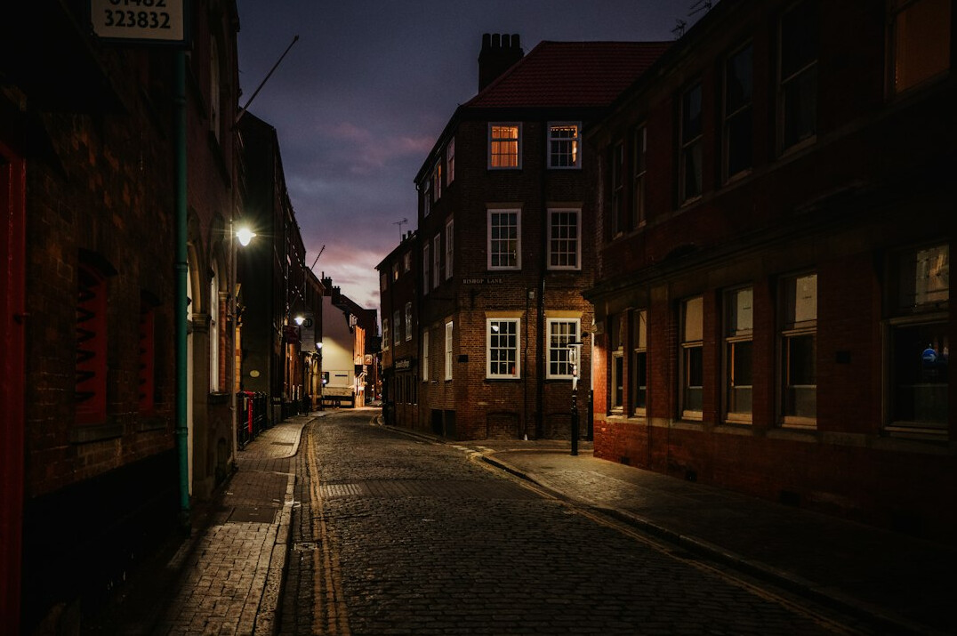 Quiet city street at dusk with old buildings