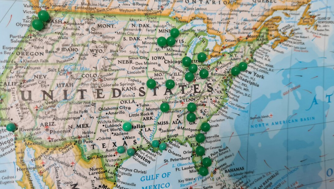 Map with pins on a table