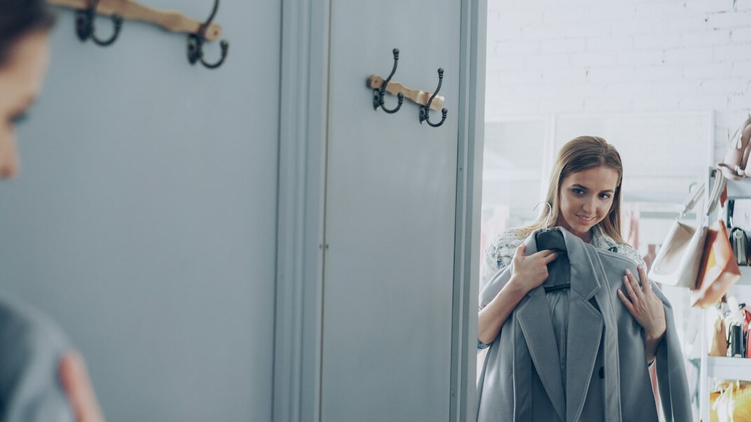 woman trying clothes in fitting room